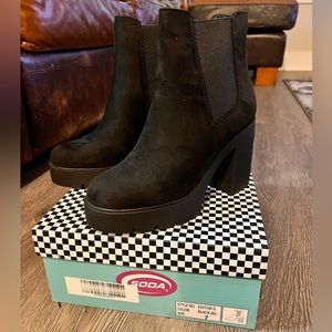 Cute black boots, 4in heels, rubber sole, easy slip on. Size 7. Never worn.